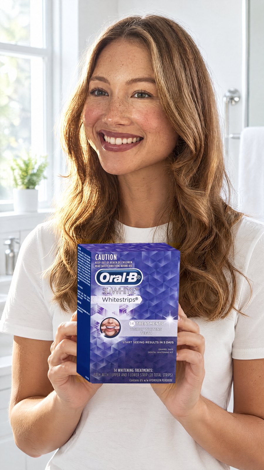 Oral B 3D White Strips 14 Teeth Whitening Treatments — held by model