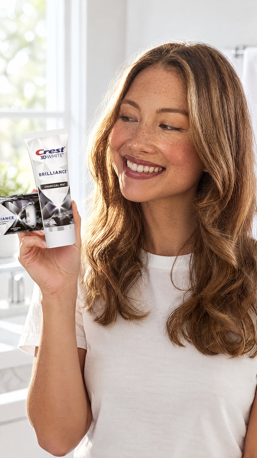 Crest 3D White Brilliance Charcoal Toothpaste 110g — close-up with model