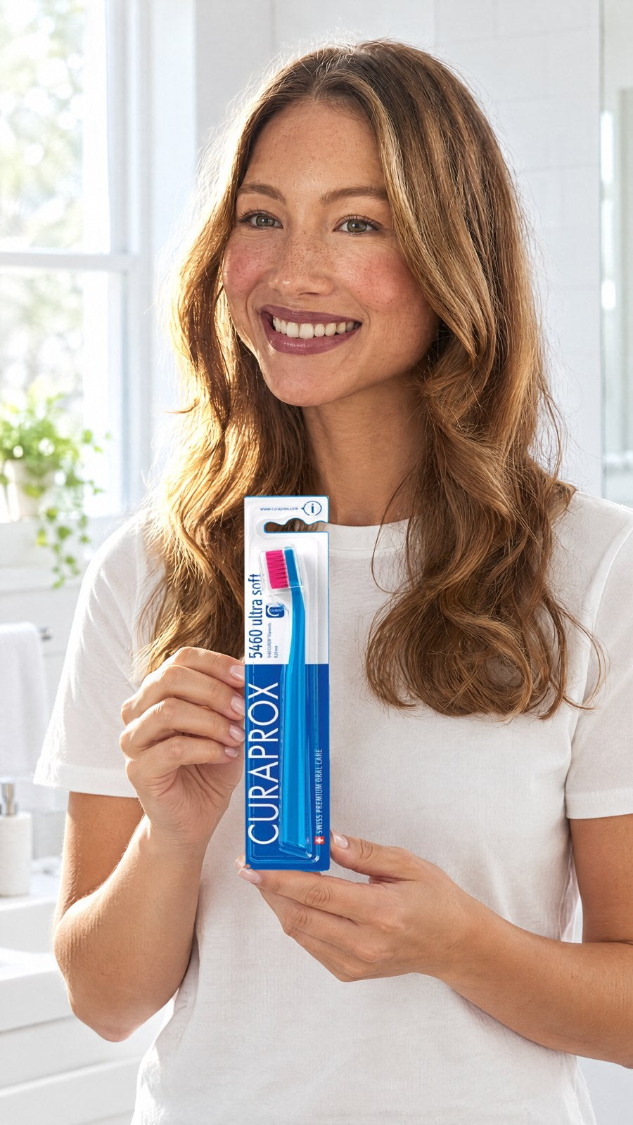CURAPROX CS 5460 Ultra-Soft Toothbrush - Royal Blue, Pack of 3 (Random Bristle Colour) — held by model