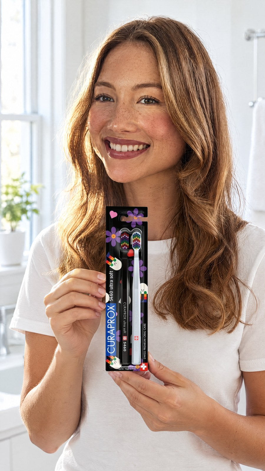 CURAPROX - TOOTHBRUSH CS 5460 HAPPY LIL TEETH EDITION, 2 PCS — held by model