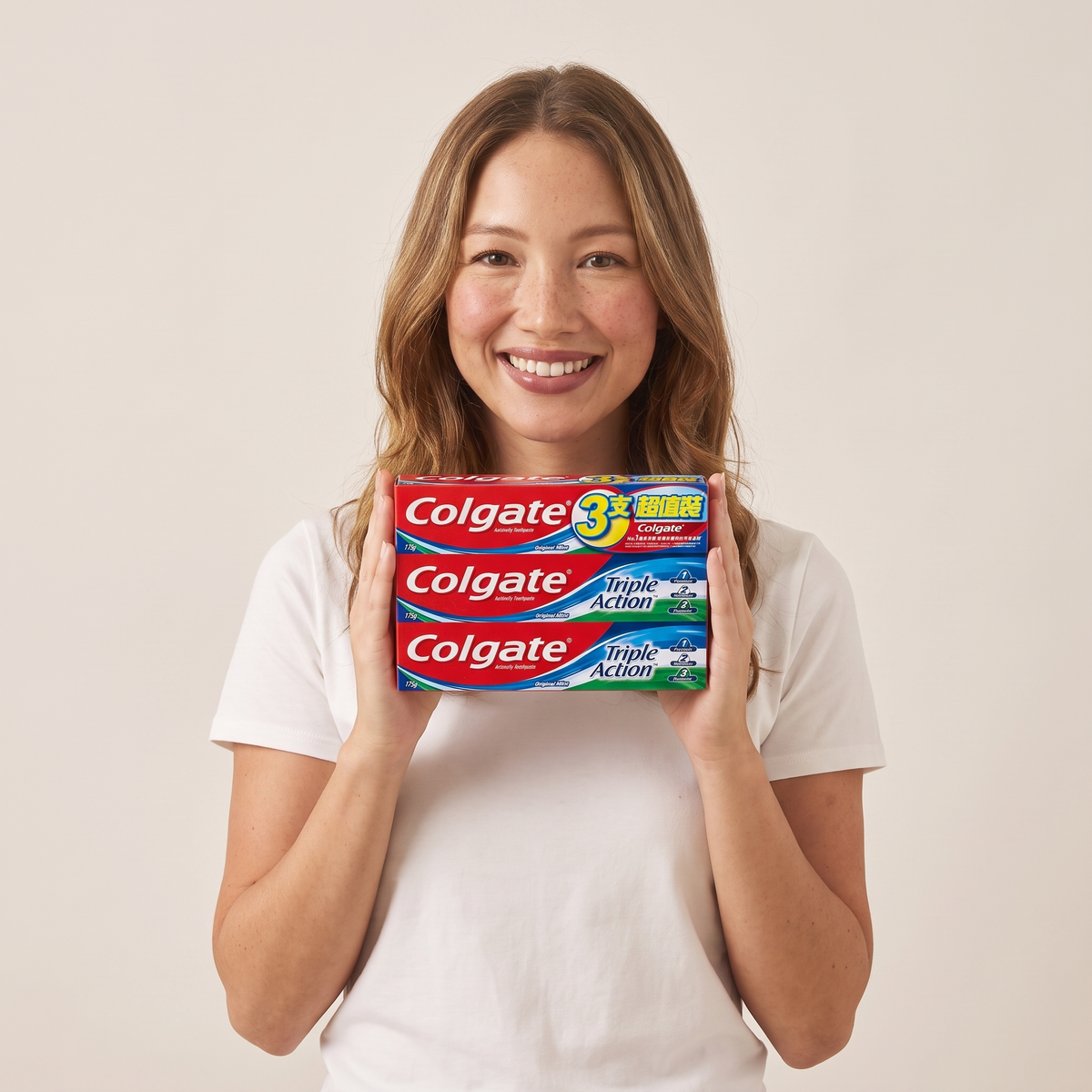 Colgate Triple Action 3-pack in hand