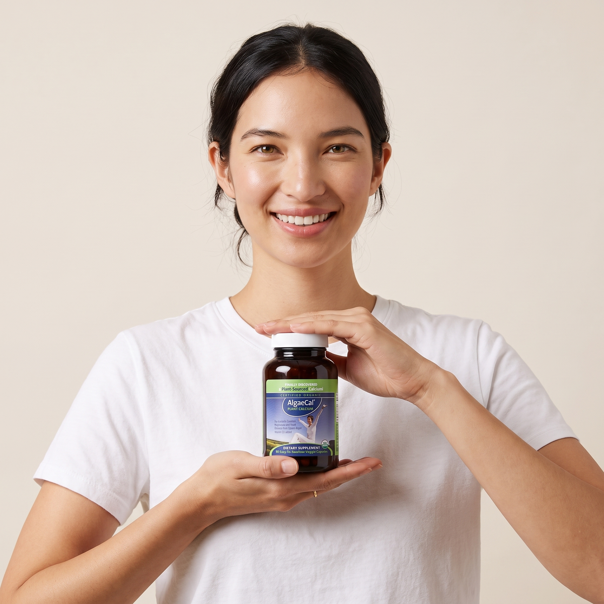 AlgaeCal bottle in hand