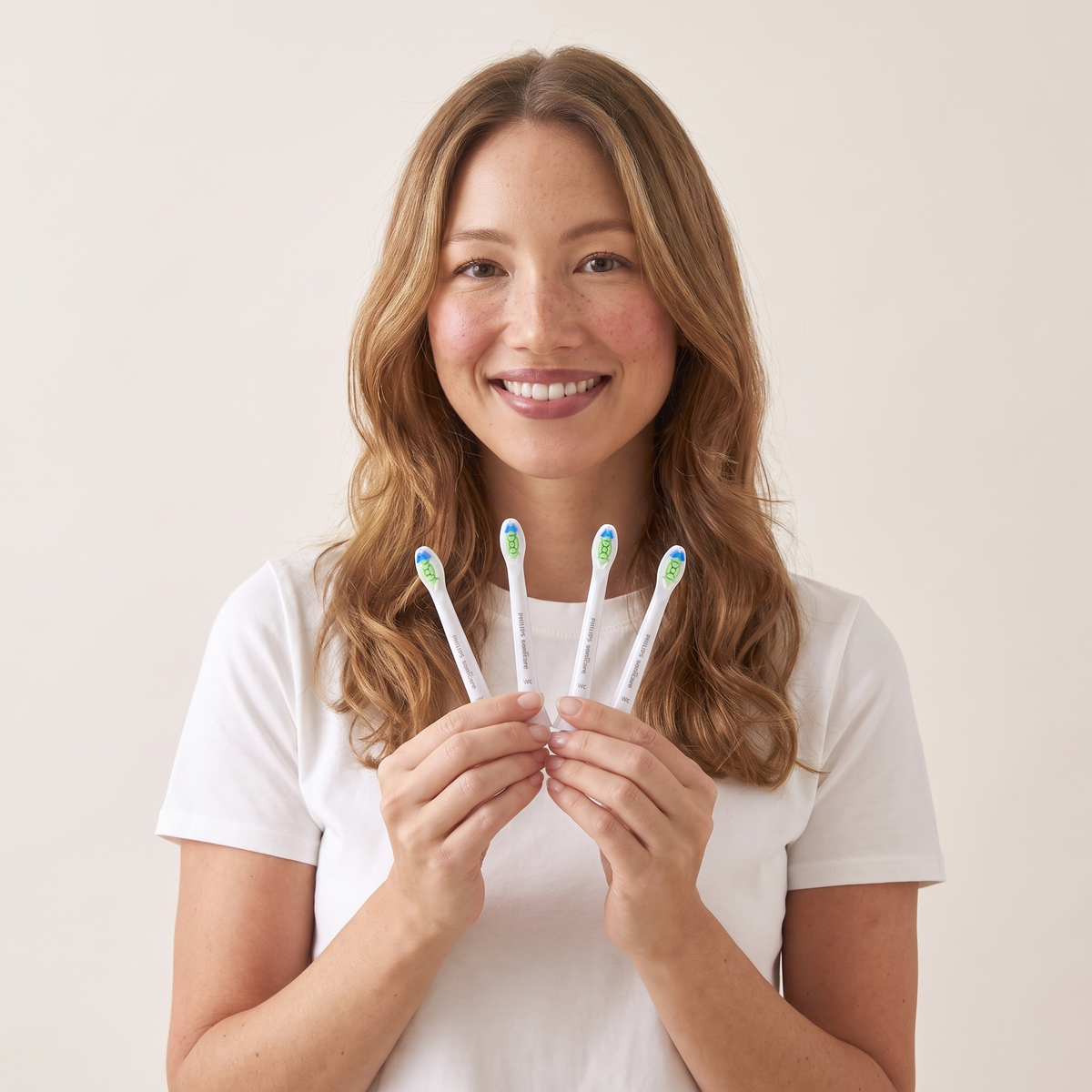 Sonicare compact heads in hand