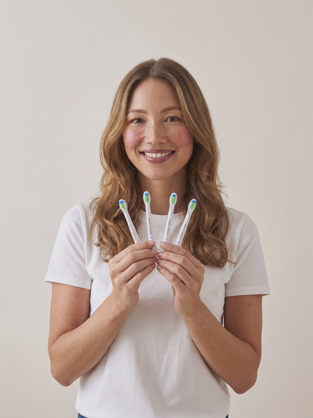 Sonicare compact heads in hand