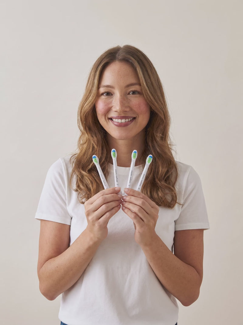 Sonicare compact heads in hand