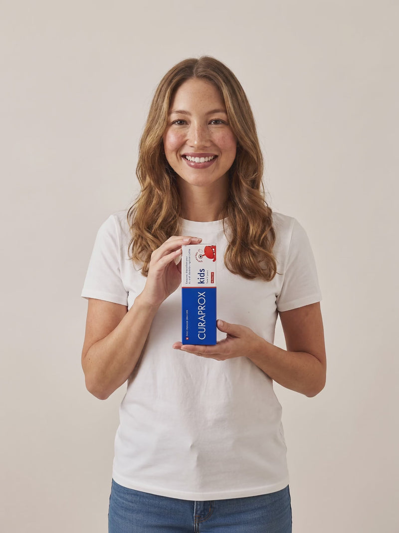 Curaprox Kids strawberry toothpaste in hand