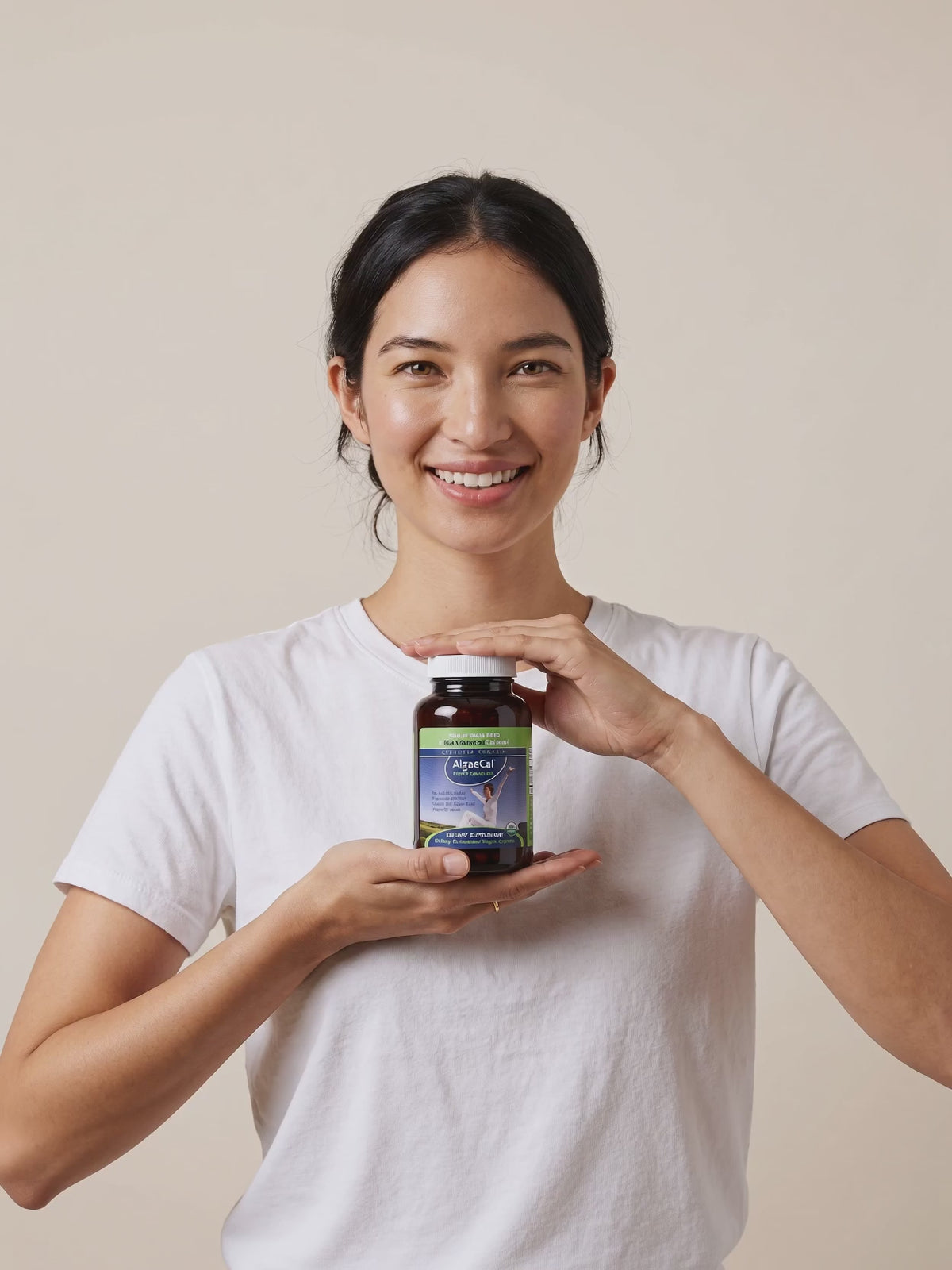 AlgaeCal bottle in hand