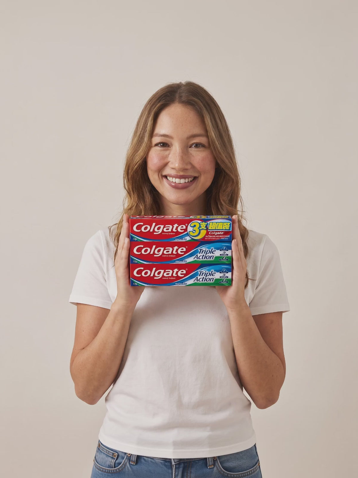 Colgate Triple Action 3-pack in hand